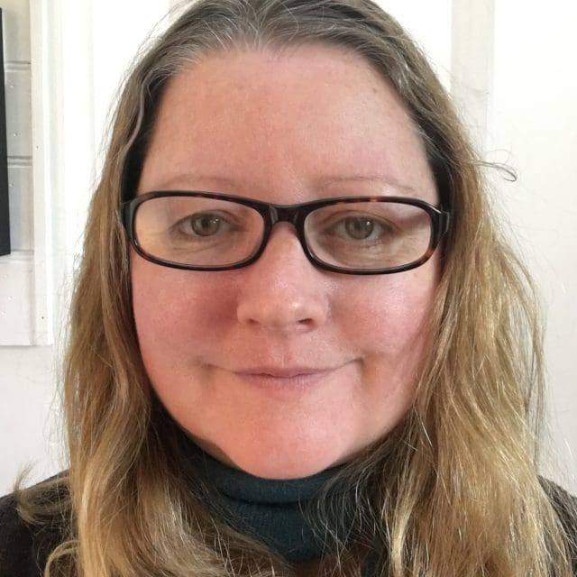 Heidi Ball Photo of Heidi Ball, Professional Writing Academy Moderator, long mousy brown hair and glasses.