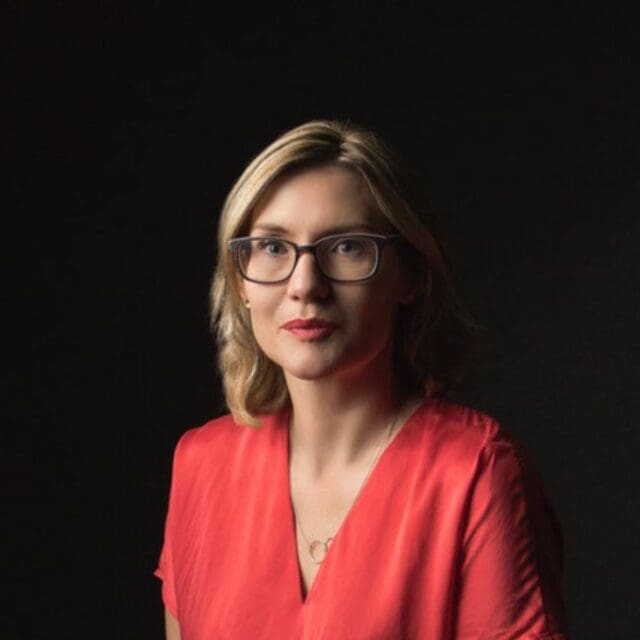 Zoe Somerville is a PWA mentor/tutor. She has shoulder length blonde hair and is wearing glasses.